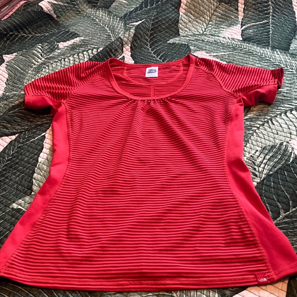 Red north face shirt